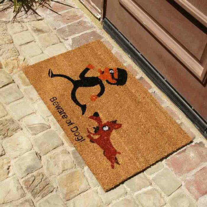 Beige beware of dog welcome mat in front of door