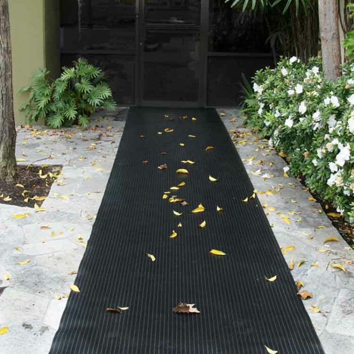 Black Color Rubber Runner Mats with Extra Toehold in Wet Conditions placed on front porch