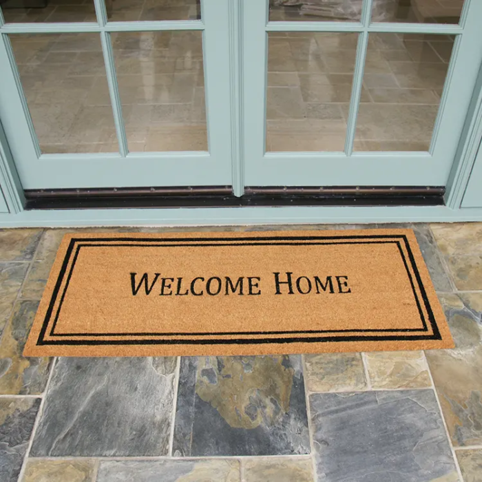 Contemporary Welcome Home Doormat in front of double doors