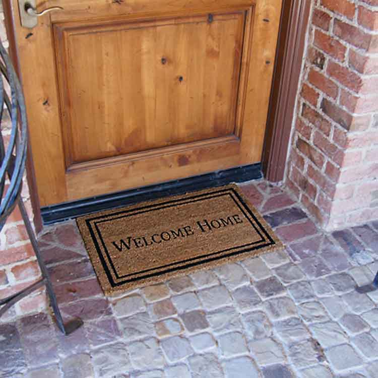 Contemporary welcome home mat in front of door
