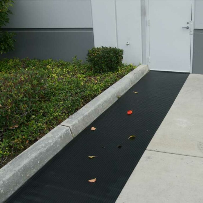 Black in color Indoor/Outdoor Slip-Resistant Rubber Floor Runners near garden