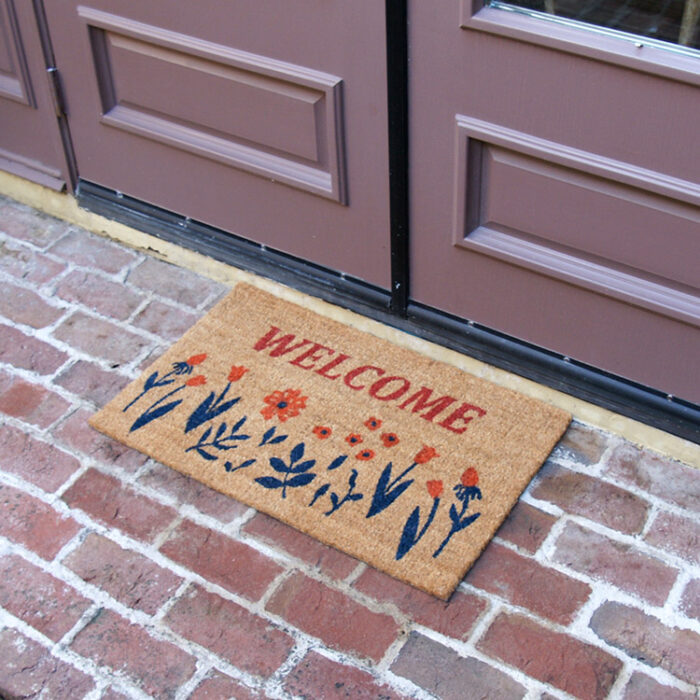 Welcome mat with picture of a garden