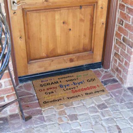 Humorous Go Away mat in front of door