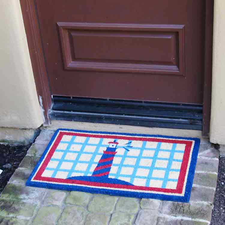 Coco Doormat with Light house picture in front of door