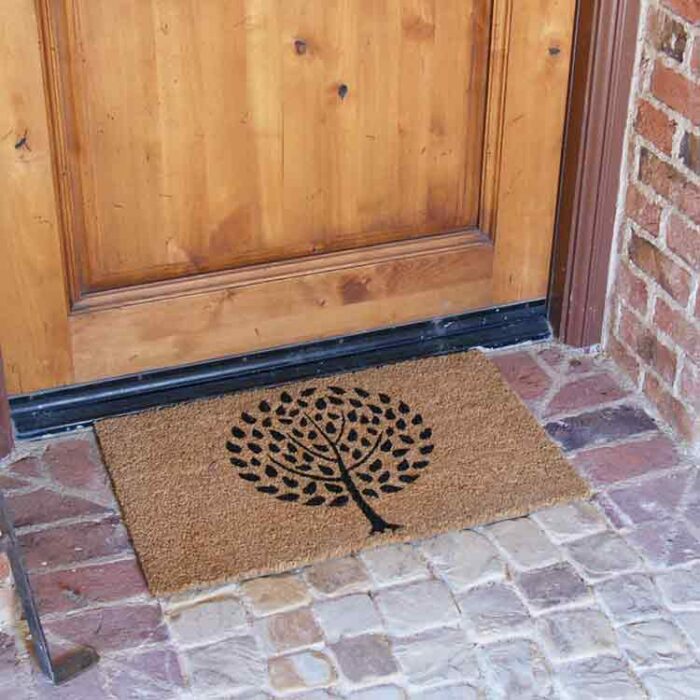 Modern Landscape Contemporary Doormat with a tree design and brown background in front of a door