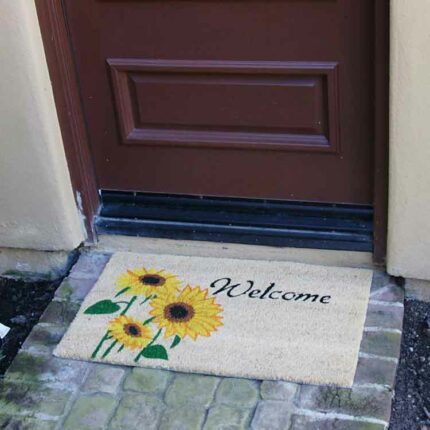 sunflower doormat in front of brown door