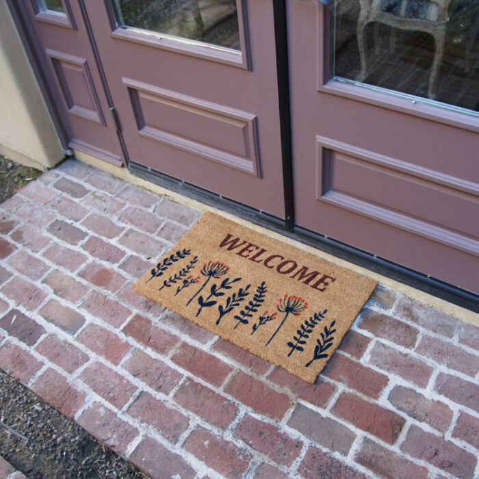 Wildflower Meadow Welcome Doormat in front of door
