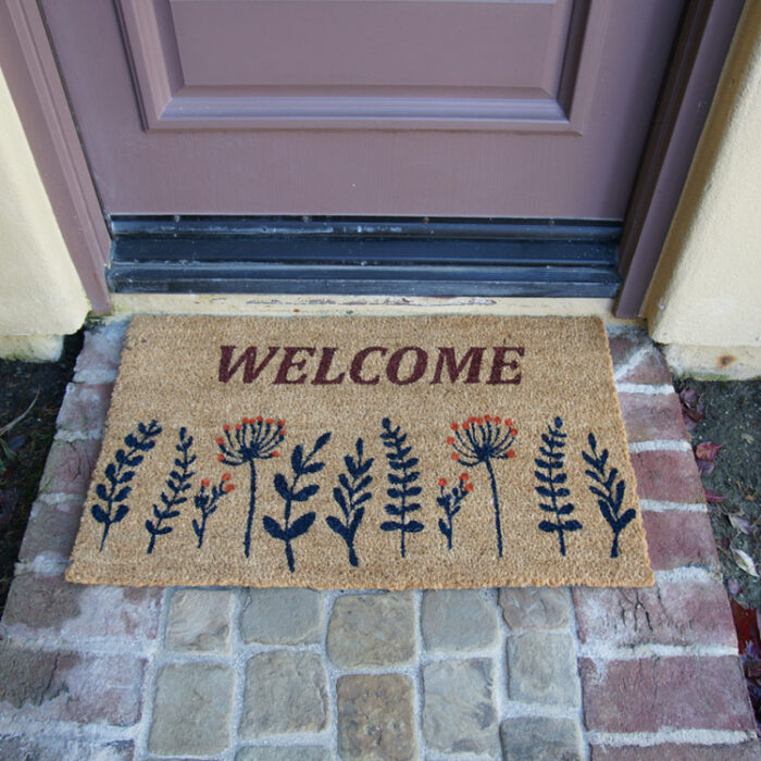 Wildflower Meadow Welcome Doormat in front of door