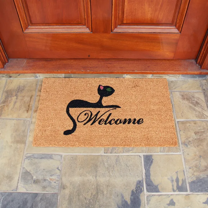 Welcome written in middle with a cat above it brown mat