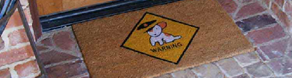 Beware of Dog welcome mat in front of door
