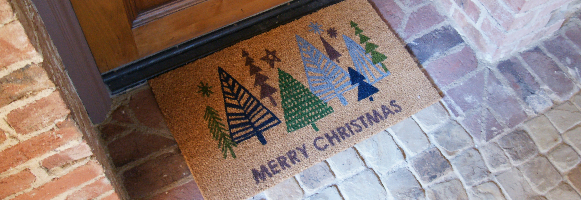 Merry Christmas caption brown text with a bunch of trees inside and a star on top