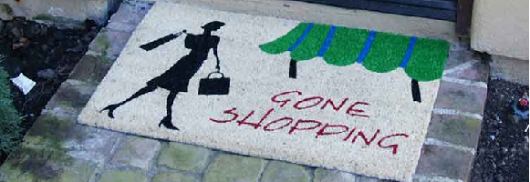 Novelty Doormat showing woman with shopping bags and message saying Gone Shopping