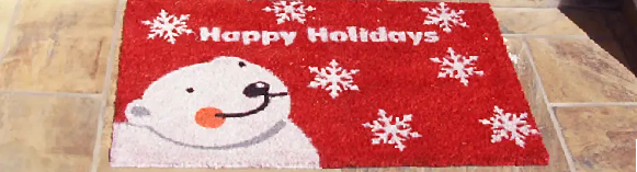Happy Holidays written in white text with a white bear next to it and snowflakes