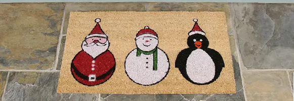 The Festive doormat with picture of Santa a snowman and a penguin