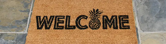 welcome to the luau pineapple in front of door