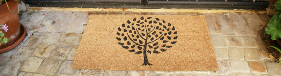 Modern Landscape Contemporary Doormat with a tree design and brown background in front of a door