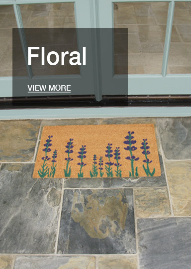 Floral doormat in front of glass door
